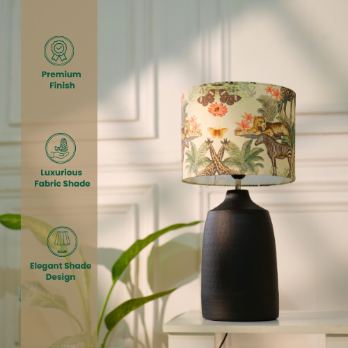 Lamp with a dark base and a jungle-themed shade, showing dimensions and features like handmade craftsmanship, E27 bulb holder, and anti-skid felt bottom