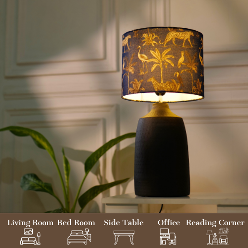 Elegant table lamp with colorful artistic shade on wooden base, placed on a desk